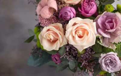 original-bouquet-roses-with-brassica-gray-wall-horizontal-image-copy-space-top-view_102556-560